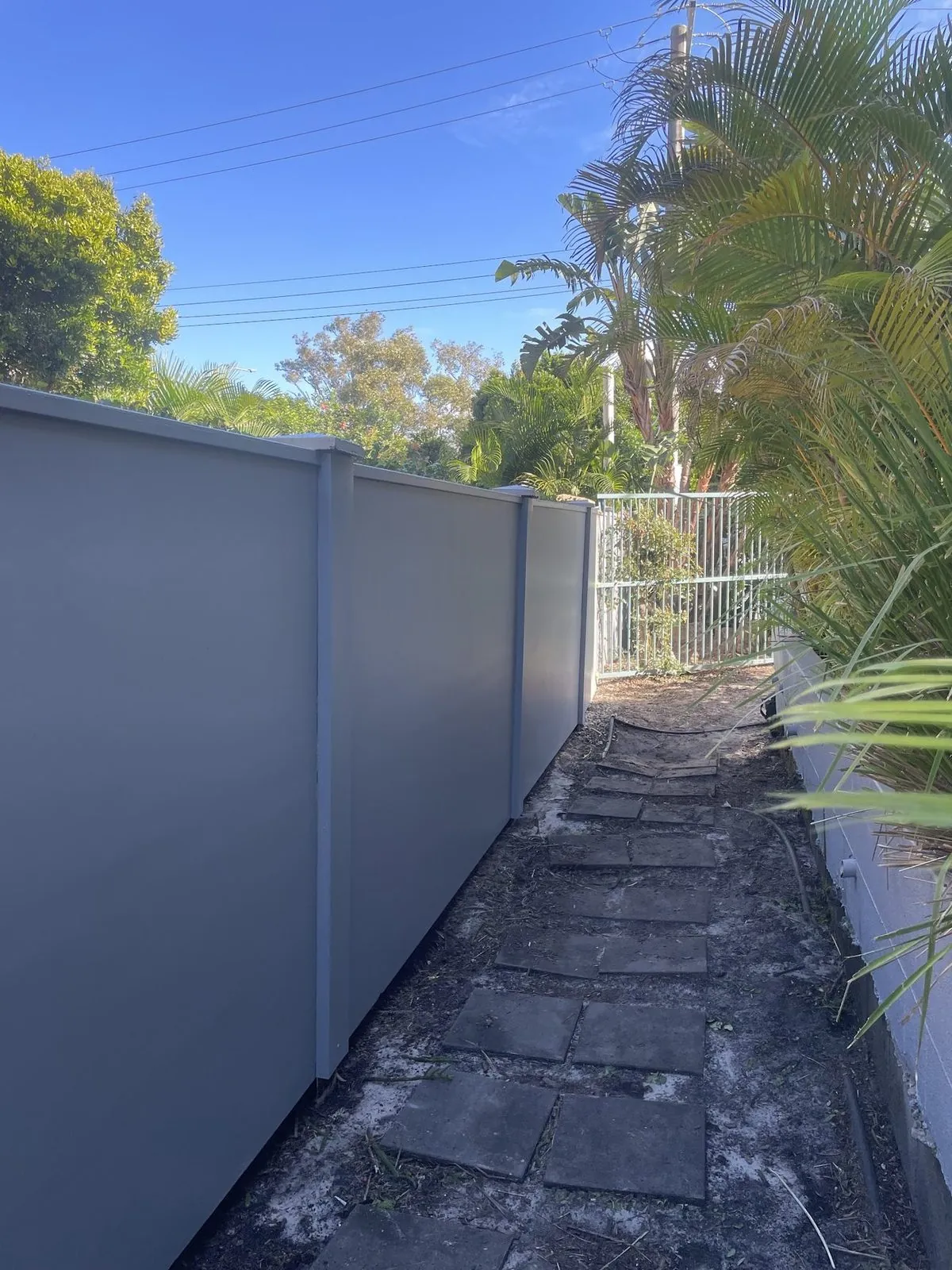 Freshly painted besser block boundary wall at Currumbin